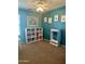 Spacious bedroom with storage unit and neutral decor, bathed in natural light for comfortable living at 491 E Jeanne Ln, San Tan Valley, AZ 85140