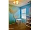 Cozy bedroom featuring bright walls, a play table, and a stylish decor at 491 E Jeanne Ln, San Tan Valley, AZ 85140