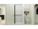 Modern bathroom with a walk-in shower, white toilet, and decorative wall art at 5064 S 234Th Ave, Buckeye, AZ 85326