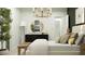 A stylish bedroom boasts modern decor, a large round mirror, and a warm, inviting ambiance at 5064 S 234Th Ave, Buckeye, AZ 85326