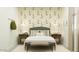 Serene bedroom featuring charming rabbit wallpaper, a plush bed, and well-coordinated bedside tables at 5064 S 234Th Ave, Buckeye, AZ 85326