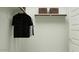 Organized closet with clothing rack, shelves, and woven baskets for optimal storage at 5064 S 234Th Ave, Buckeye, AZ 85326