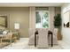 Stylish dining room featuring a large window, neutral color palette, and modern furniture at 5064 S 234Th Ave, Buckeye, AZ 85326