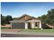 Charming single-story home featuring a two-car garage, neutral paint, and well-manicured landscaping at 5064 S 234Th Ave, Buckeye, AZ 85326