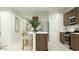 Bright, modern kitchen with a center island, stainless steel appliances, and sleek cabinets at 5064 S 234Th Ave, Buckeye, AZ 85326