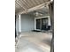 Relaxing back patio with sliding glass doors, ceiling fan, string lights, and comfortable seating area at 5303 W Port Au Prince Ln, Glendale, AZ 85306