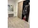 Bedroom closet with wooden sliding doors, vanity, and storage at 5303 W Port Au Prince Ln, Glendale, AZ 85306
