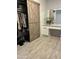 Bedroom closet with wooden sliding doors, vanity, and open storage at 5303 W Port Au Prince Ln, Glendale, AZ 85306