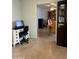 View of a dining room with a distinctive table set and cabinets, visible from a study space at 5303 W Port Au Prince Ln, Glendale, AZ 85306