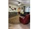 Open living space with sofas, an area rug, ceiling fan, and decoratively adorned walls at 5303 W Port Au Prince Ln, Glendale, AZ 85306