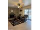 Comfortable living room featuring a cozy fireplace, seating, and natural lighting at 5303 W Port Au Prince Ln, Glendale, AZ 85306