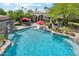 Aerial view of a stunning pool with a waterfall feature, lounge area, and lush landscaping at 5402 E Cortez Dr, Scottsdale, AZ 85254