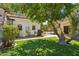 Lush backyard featuring a serene statue, verdant landscaping, and a tranquil outdoor space at 5402 E Cortez Dr, Scottsdale, AZ 85254