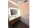 Modern bathroom featuring an illuminated mirror and sleek vanity with white countertop at 5402 E Cortez Dr, Scottsdale, AZ 85254