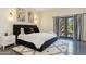 Stylishly decorated bedroom with a dark bed frame and black and white accents at 5402 E Cortez Dr, Scottsdale, AZ 85254