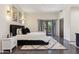 Nicely decorated bedroom featuring a dark bed frame and doors leading to the outside at 5402 E Cortez Dr, Scottsdale, AZ 85254