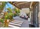 Inviting courtyard with stone pillars, wooden pergola, and comfortable seating for relaxing outdoors at 5402 E Cortez Dr, Scottsdale, AZ 85254