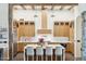 Beautiful kitchen featuring natural wood cabinetry, a waterfall island with seating, and modern stainless steel appliances at 5402 E Cortez Dr, Scottsdale, AZ 85254