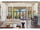 Bright living room features a large glass door and polished concrete floors with views of the exterior pool area at 5402 E Cortez Dr, Scottsdale, AZ 85254