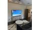Cozy living room featuring a flat-screen TV, stylish furniture, and modern decor at 5402 E Cortez Dr, Scottsdale, AZ 85254