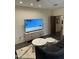 Cozy living room featuring a flat-screen TV, stylish furniture, and modern decor at 5402 E Cortez Dr, Scottsdale, AZ 85254
