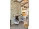 Open-concept living space with stone fireplace and hardwood floors at 5402 E Cortez Dr, Scottsdale, AZ 85254
