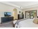 Spacious main bedroom features a large TV, exterior views, and contemporary furnishings, creating a luxurious space at 5402 E Cortez Dr, Scottsdale, AZ 85254