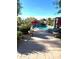 Resort-style pool area with rock waterfall, lounge chairs, and lush landscaping for ultimate relaxation at 5402 E Cortez Dr, Scottsdale, AZ 85254