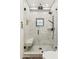 Modern walk-in shower featuring beautiful tile work, a sleek design, and convenient bench seating at 5402 E Cortez Dr, Scottsdale, AZ 85254