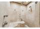 Luxurious tiled shower with dual showerheads and built-in bench seating at 5402 E Cortez Dr, Scottsdale, AZ 85254