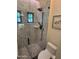 Tile shower stall featuring a rainfall shower head and sleek glass door at 5402 E Cortez Dr, Scottsdale, AZ 85254