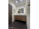 Modern vanity with a backlit mirror and under-cabinet lighting at 5402 E Cortez Dr, Scottsdale, AZ 85254