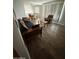 Bright living room showcasing wood-look floors and comfortable seating arrangements at 5517 E Boise St, Mesa, AZ 85205