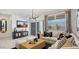 Bright living room boasting a large window, elegant curtains, and comfortable seating arrangement at 5549 E Mearn Rd, San Tan Valley, AZ 85140