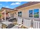 Covered back patio with a grill, seating area, and view of the landscaped backyard at 560 W Duke Dr, Tempe, AZ 85283