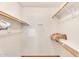 Walk-in closet with wood floors and ample shelving for organization at 560 W Duke Dr, Tempe, AZ 85283