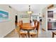 Dining area showcasing a wooden table, floral chairs, and convenient access to the kitchen at 560 W Duke Dr, Tempe, AZ 85283