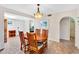 Inviting dining room featuring a round table, tile floors, and seamless access to other living spaces at 560 W Duke Dr, Tempe, AZ 85283