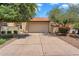 Charming single-level home featuring a two-car garage and mature landscaping in a well-maintained community at 560 W Duke Dr, Tempe, AZ 85283