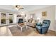 Inviting living room with comfortable seating, ceiling fan, and access to the backyard, perfect for relaxing at 560 W Duke Dr, Tempe, AZ 85283