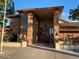 Brick exterior building, featuring a covered entrance and manicured landscaping at 5735 E Mcdowell Rd # 63, Mesa, AZ 85215