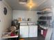 Organized garage space with storage shelves and full-size washer and dryer at 5735 E Mcdowell Rd # 63, Mesa, AZ 85215