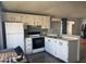 Efficient kitchen featuring bright cabinets, modern appliances, and ample counter space at 5735 E Mcdowell Rd # 63, Mesa, AZ 85215