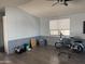 Cozy living room with wood-look flooring, neutral walls, and abundant natural light at 5735 E Mcdowell Rd # 63, Mesa, AZ 85215