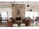 Inviting lounge area with a brick fireplace, comfortable seating, and a relaxed atmosphere at 5735 E Mcdowell Rd # 63, Mesa, AZ 85215