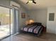 Serene bedroom with private access to outdoor patio, bright light, and vinyl floors at 5735 E Mcdowell Rd # 63, Mesa, AZ 85215