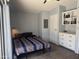 Comfortable bedroom with built-in storage, soft lighting, and calming neutral tones at 5735 E Mcdowell Rd # 63, Mesa, AZ 85215