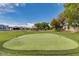 Well-manicured community putting green offers residents a great place to enjoy the outdoors at 5735 E Mcdowell Rd # 63, Mesa, AZ 85215