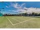 Outdoor tennis court with green surface, providing a perfect space for recreation and exercise at 5735 E Mcdowell Rd # 63, Mesa, AZ 85215