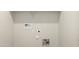 Functional laundry area features utility hookups and ample wall space for storage solutions at 5845 E Axle Ln, San Tan Valley, AZ 85140